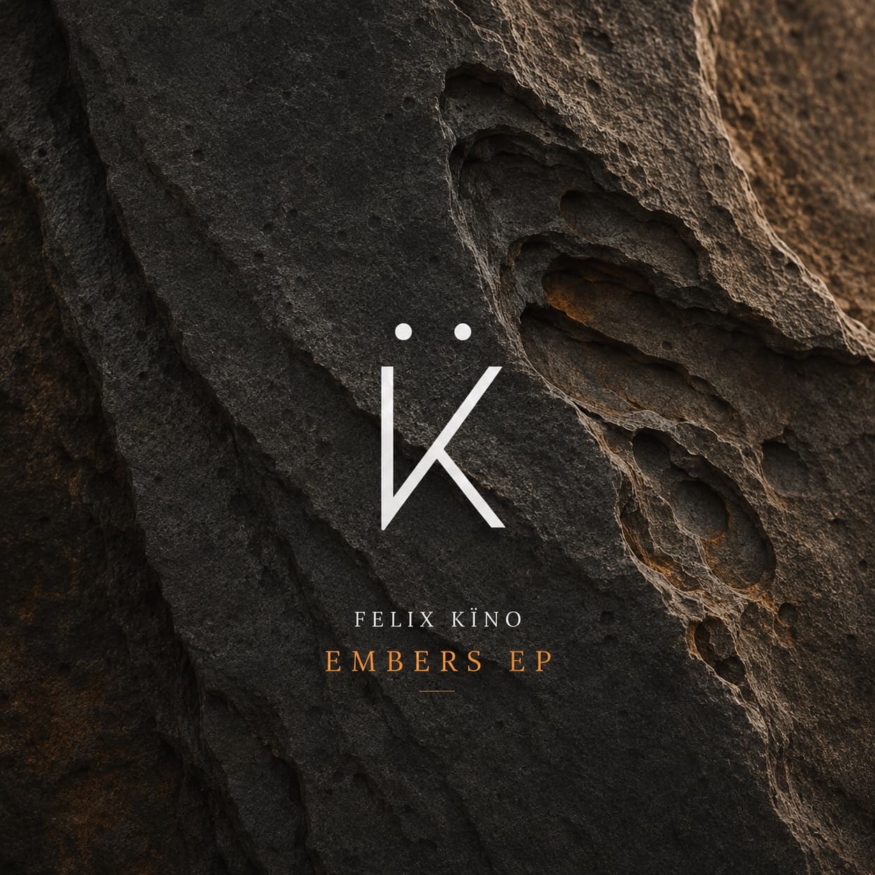 Embers EP cover art — the Felix Kïno mark carved into dark volcanic rock